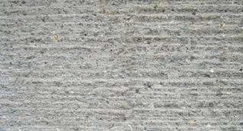 The original floor of the workshop with a wool chisel into a pitted surface